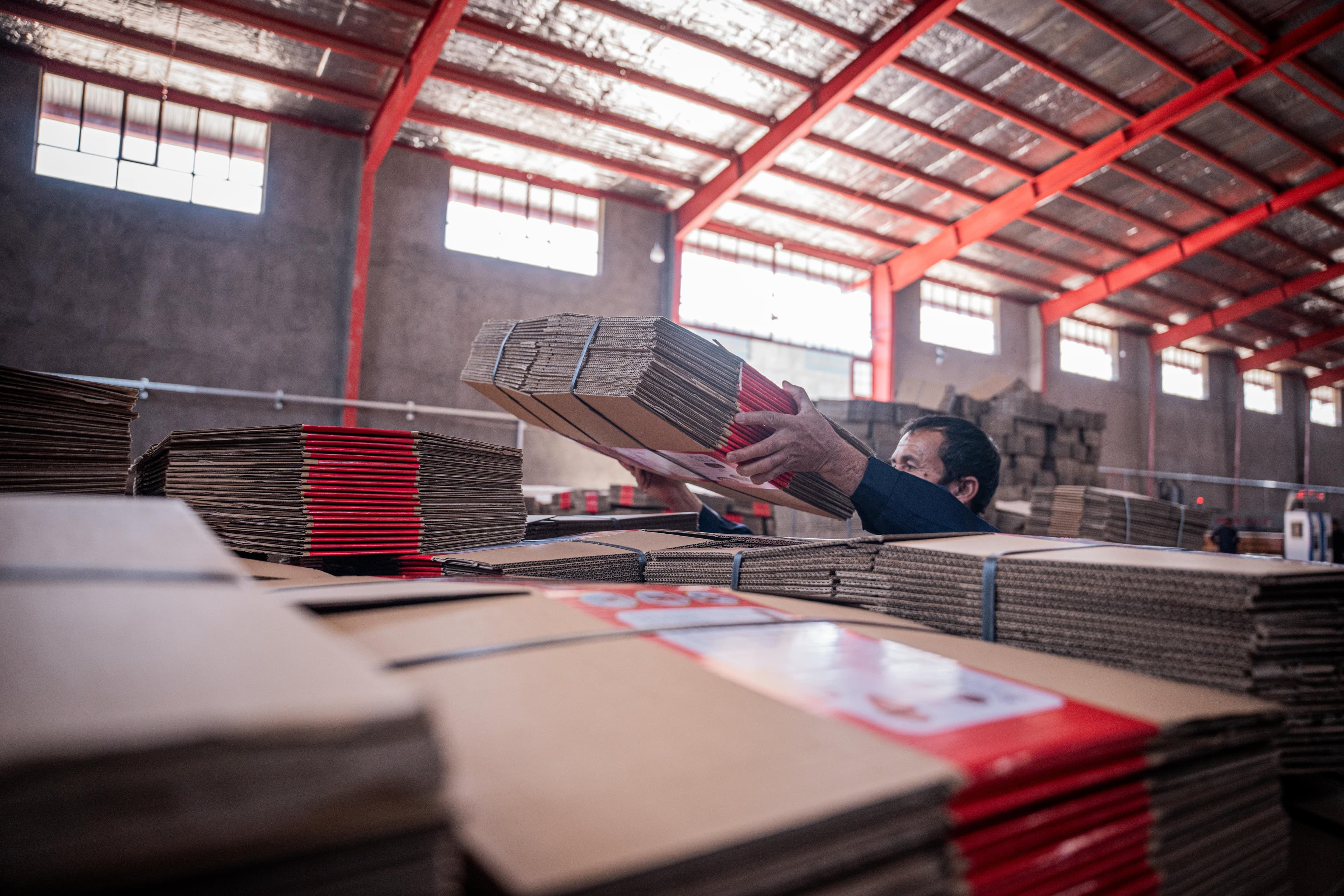 a worker is orginizing sheet